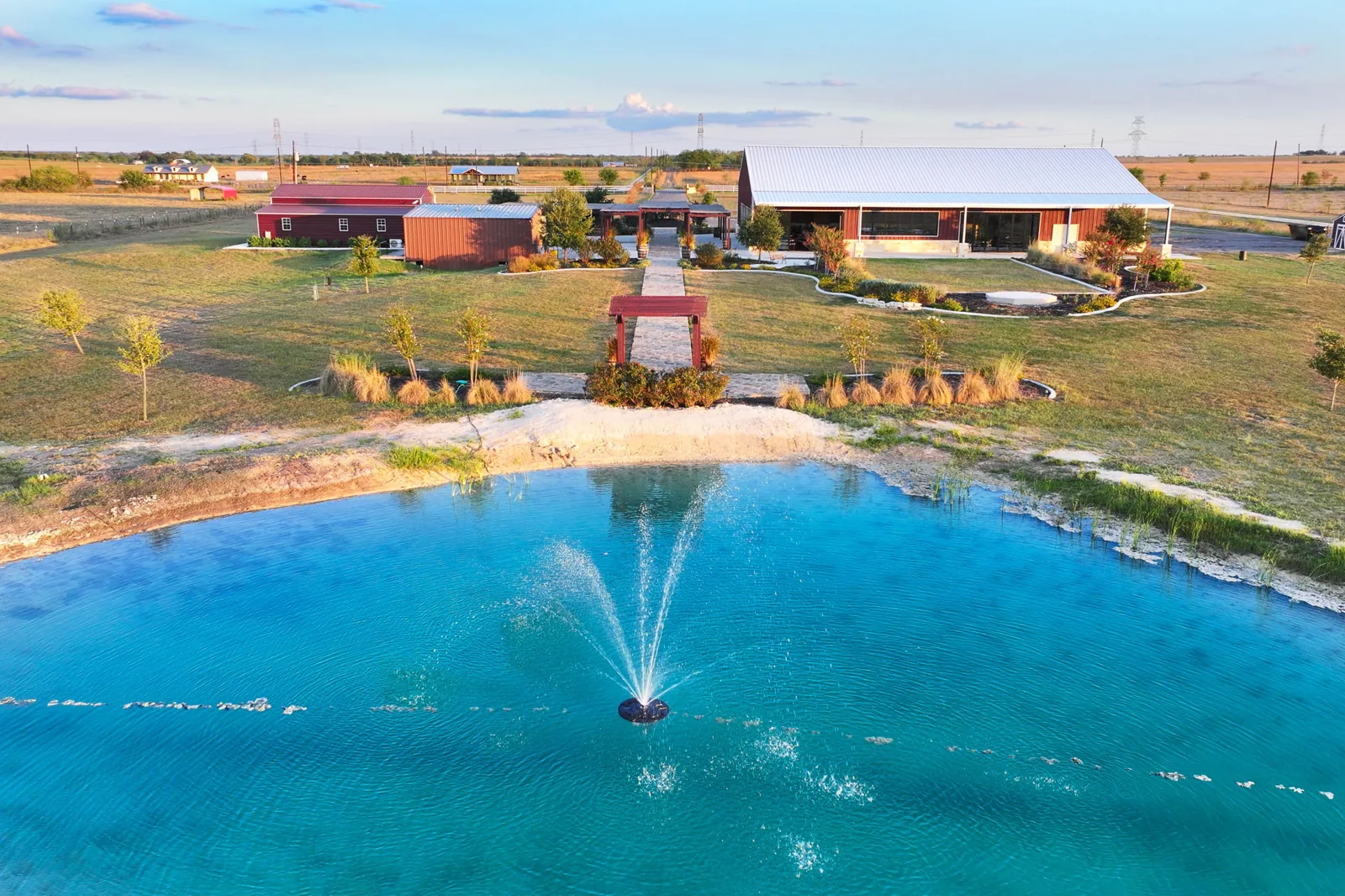 An aerial view of the Enchanted Ranch pond and grounds