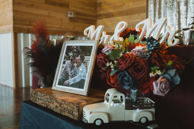 Personalized wedding welcome display with autumn flowers