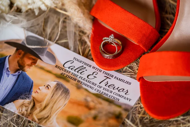 Red wedding shoes and personal keepsakes arranged together