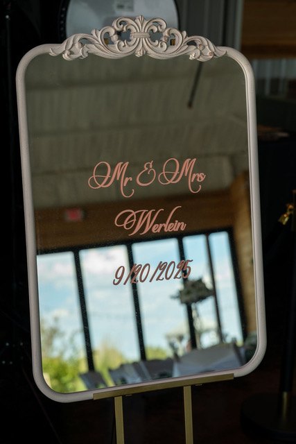 A decorated welcome sign with floral accents