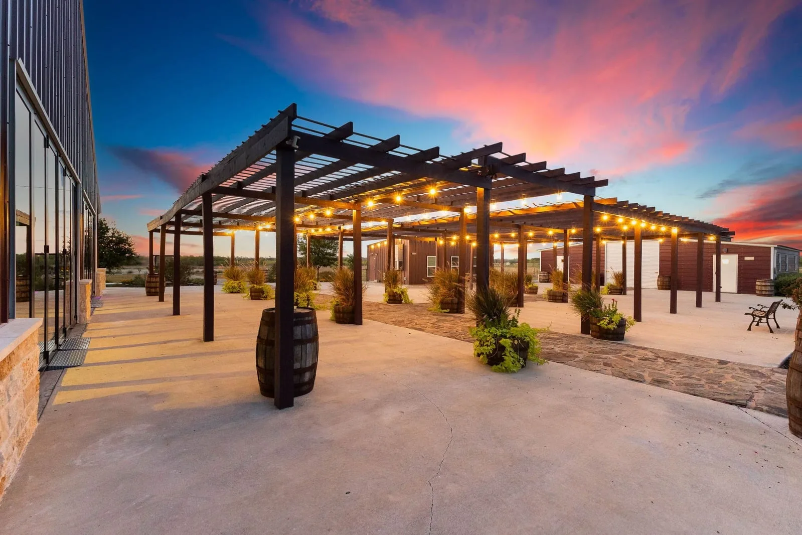 The illuminated Enchanted Ranch pergola at sunset